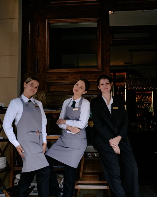 Restaurant and hotel staff in service uniform