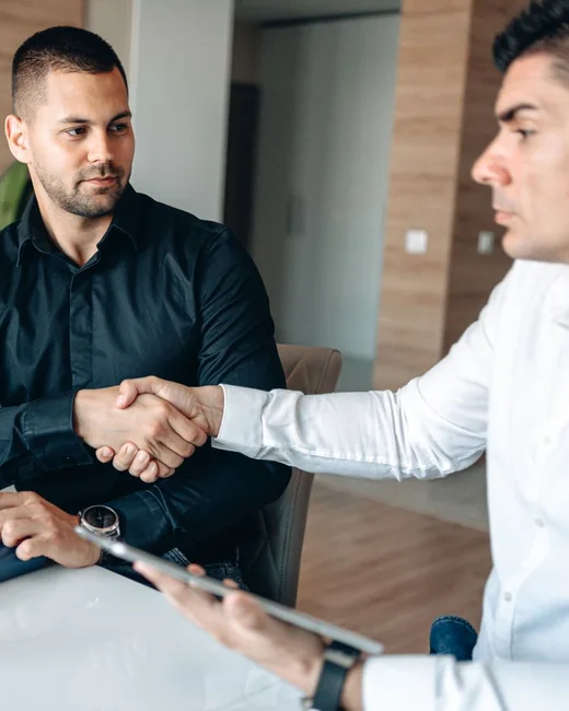 Two professionals shaking hands