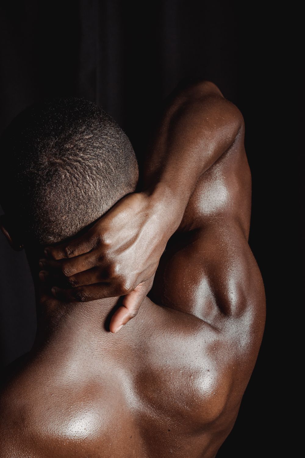 The back and shoulder of a muscular person